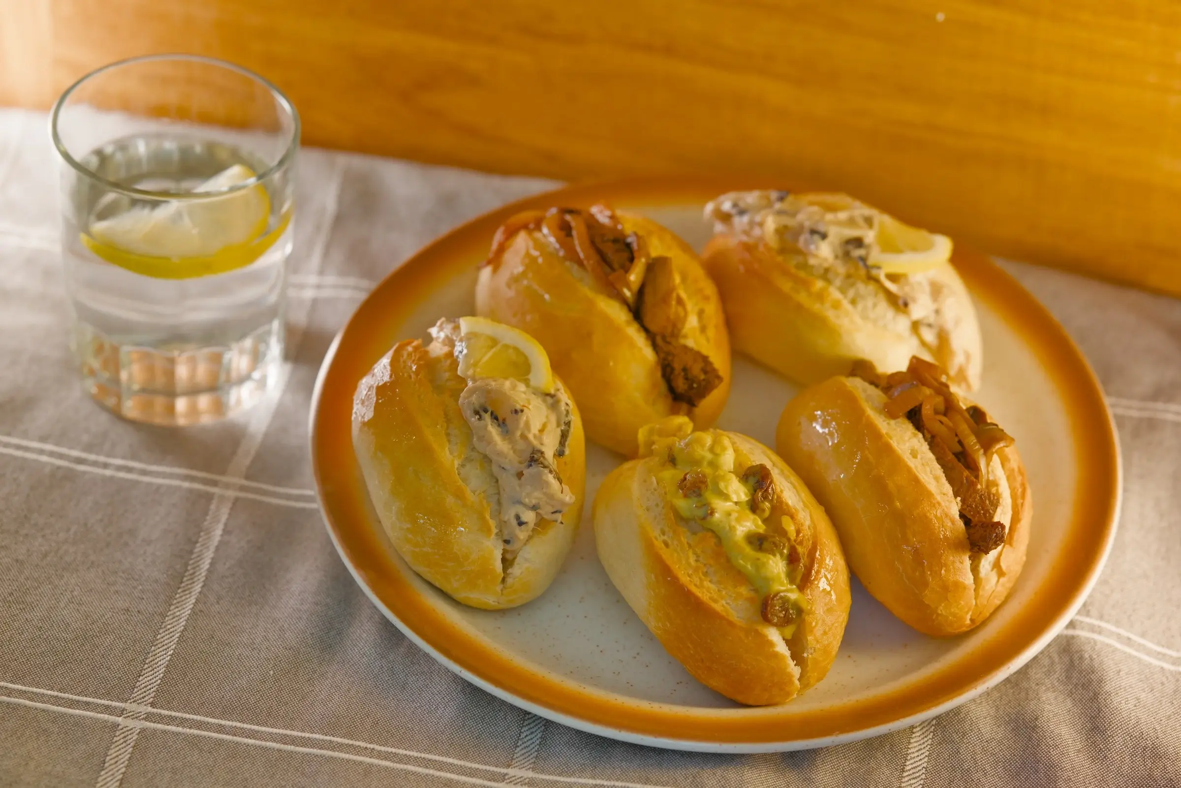 Hearts of palm prawn-style sandwiches arranged on a board.