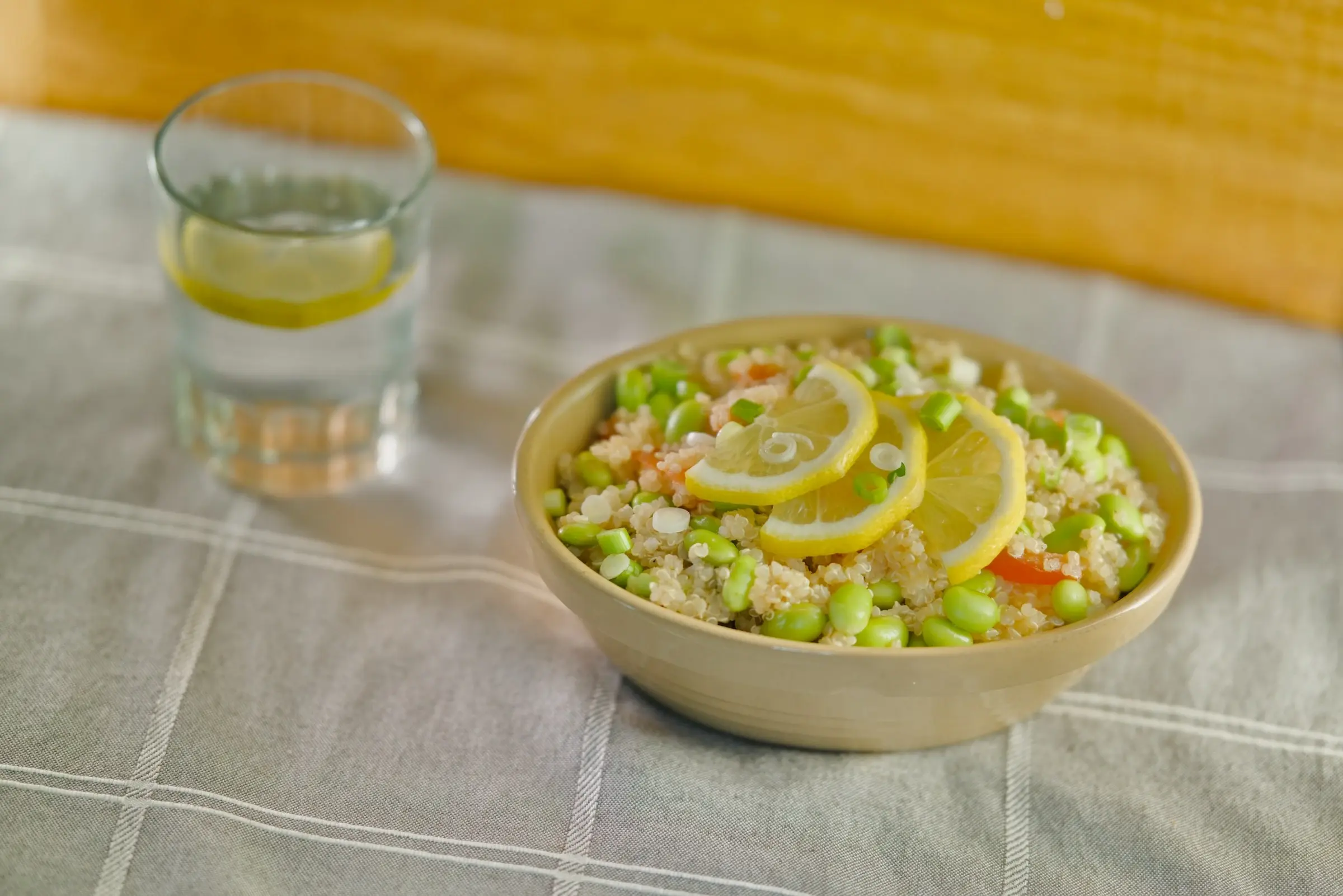 Quinoa salad with vegetables in a serving bowl.