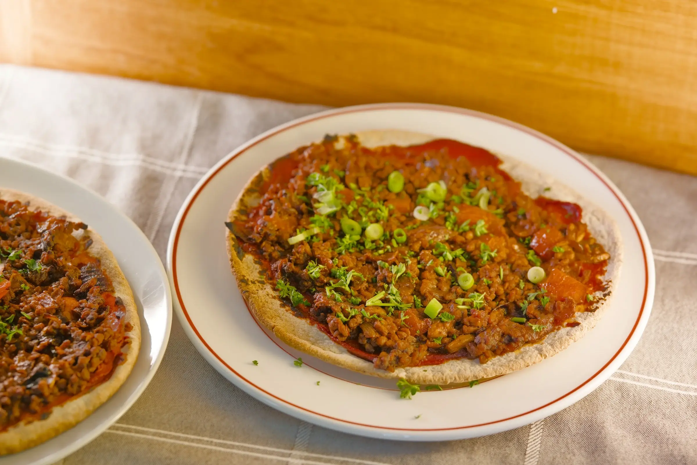 Vegan lahmacun flatbreads topped with mince.