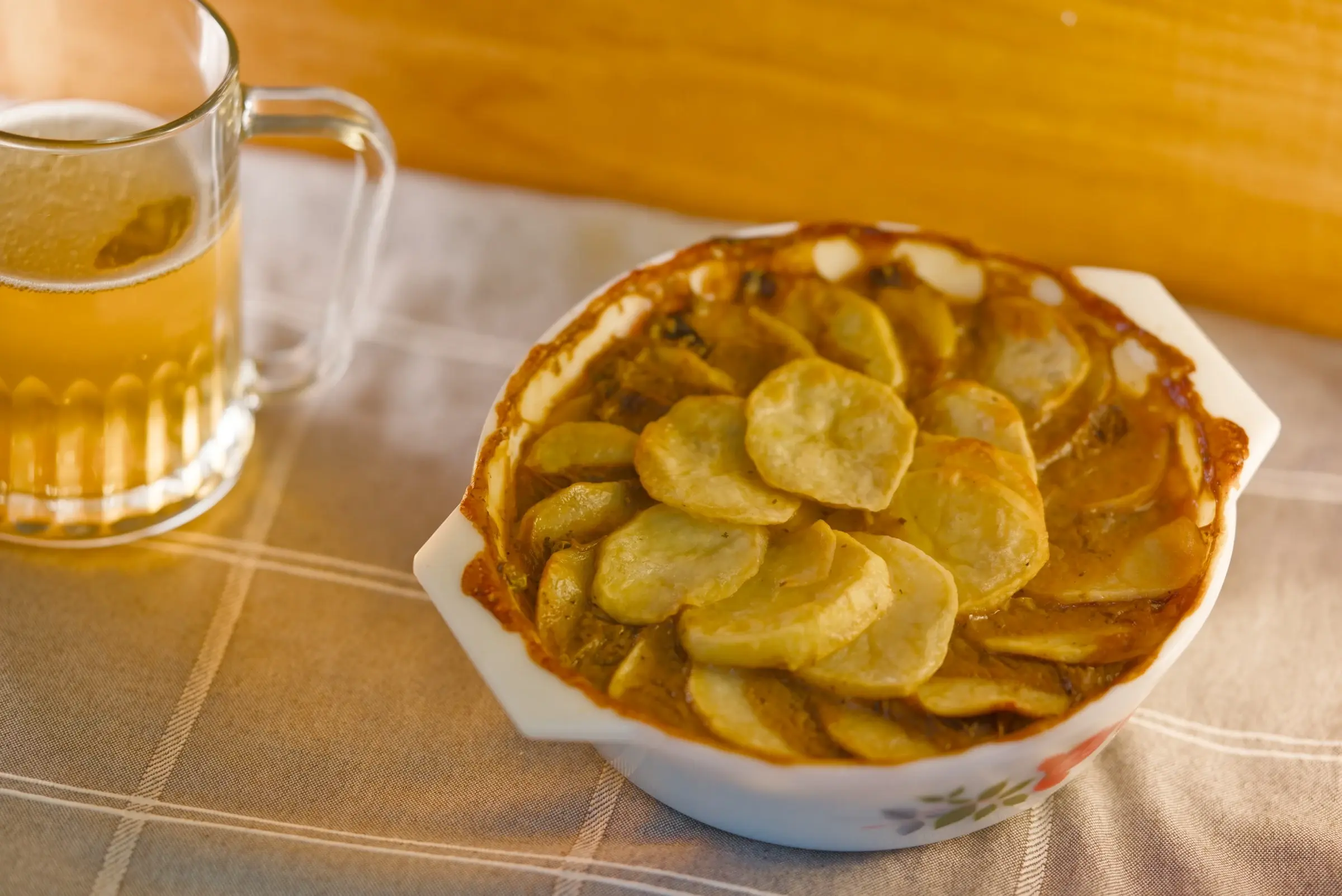 Vegan Lancashire hotpot with sliced potato topping.
